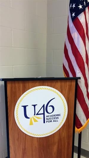 U-46 sign on podium with US flag 